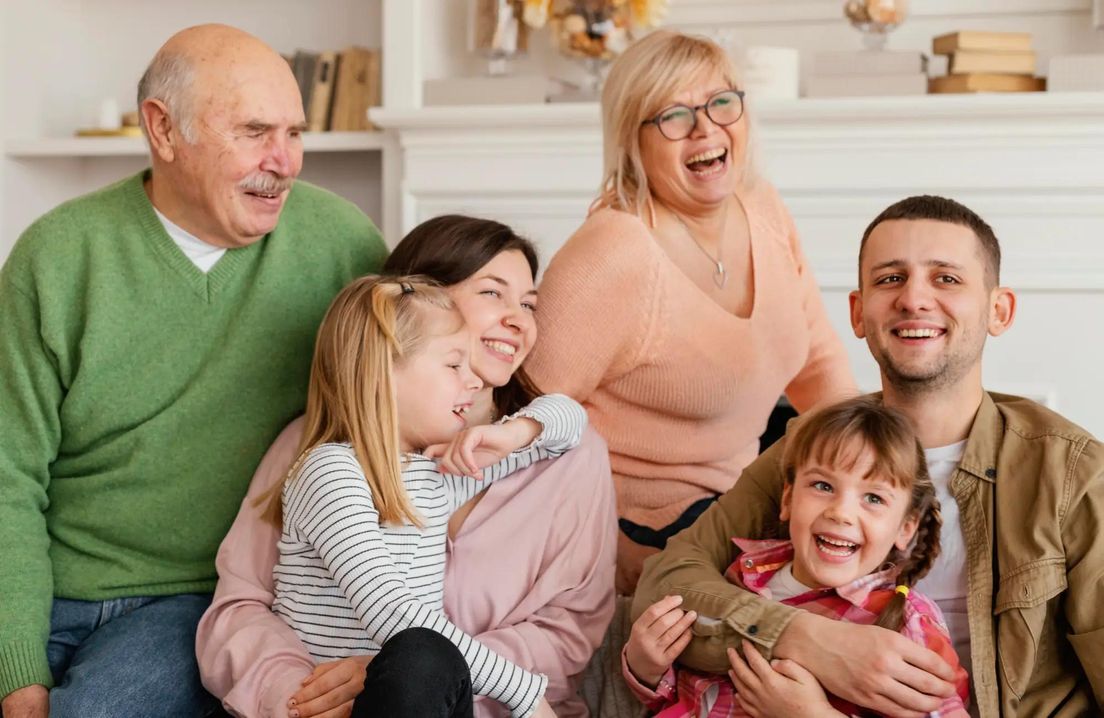 Happy multi-generational family at home – concept of sponsoring relatives for Canadian immigration