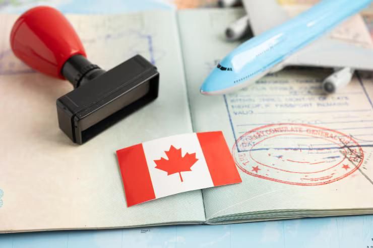 Person filling out study permit application form to switch from visitor visa in Canada