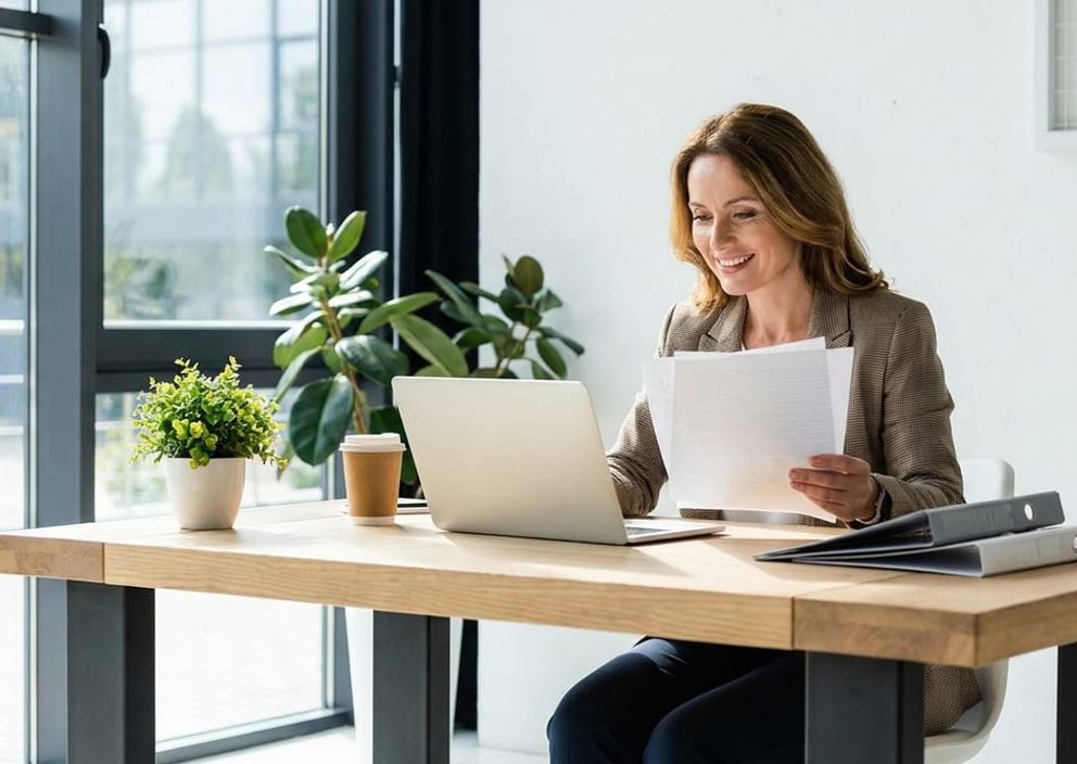 Professional immigration consultant reviewing Express Entry documents at a modern desk