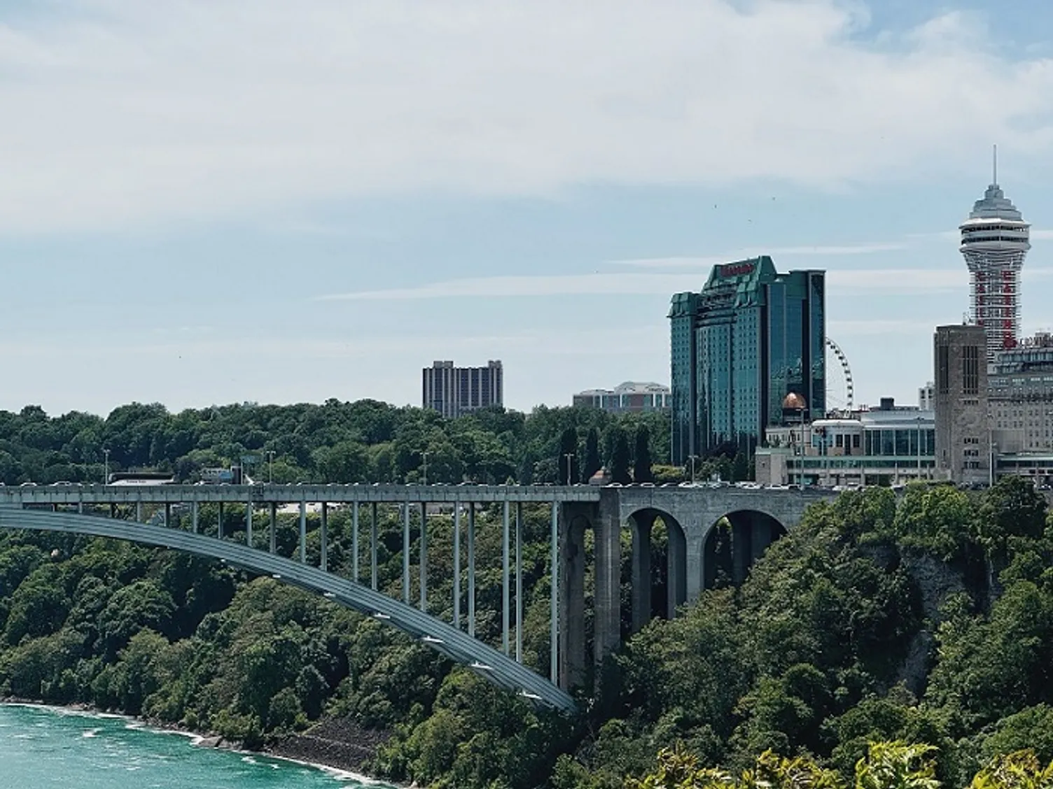 The Rainbow Bridge border crossing spanning the river gorge toward the Niagara Falls skyline.