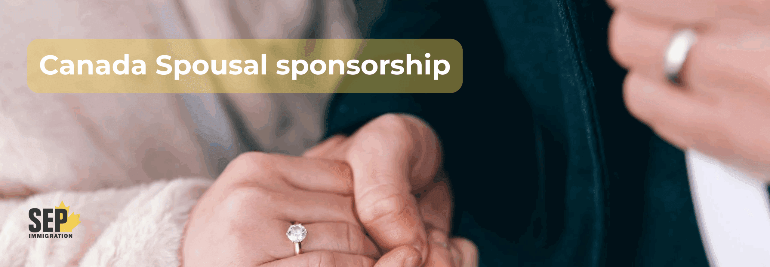 close-up of a couple holding hands with visible wedding rings, symbolizing marriage and spousal sponsorship.