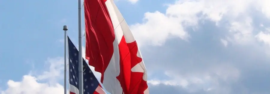 the Canadian flag and the American flag side by side