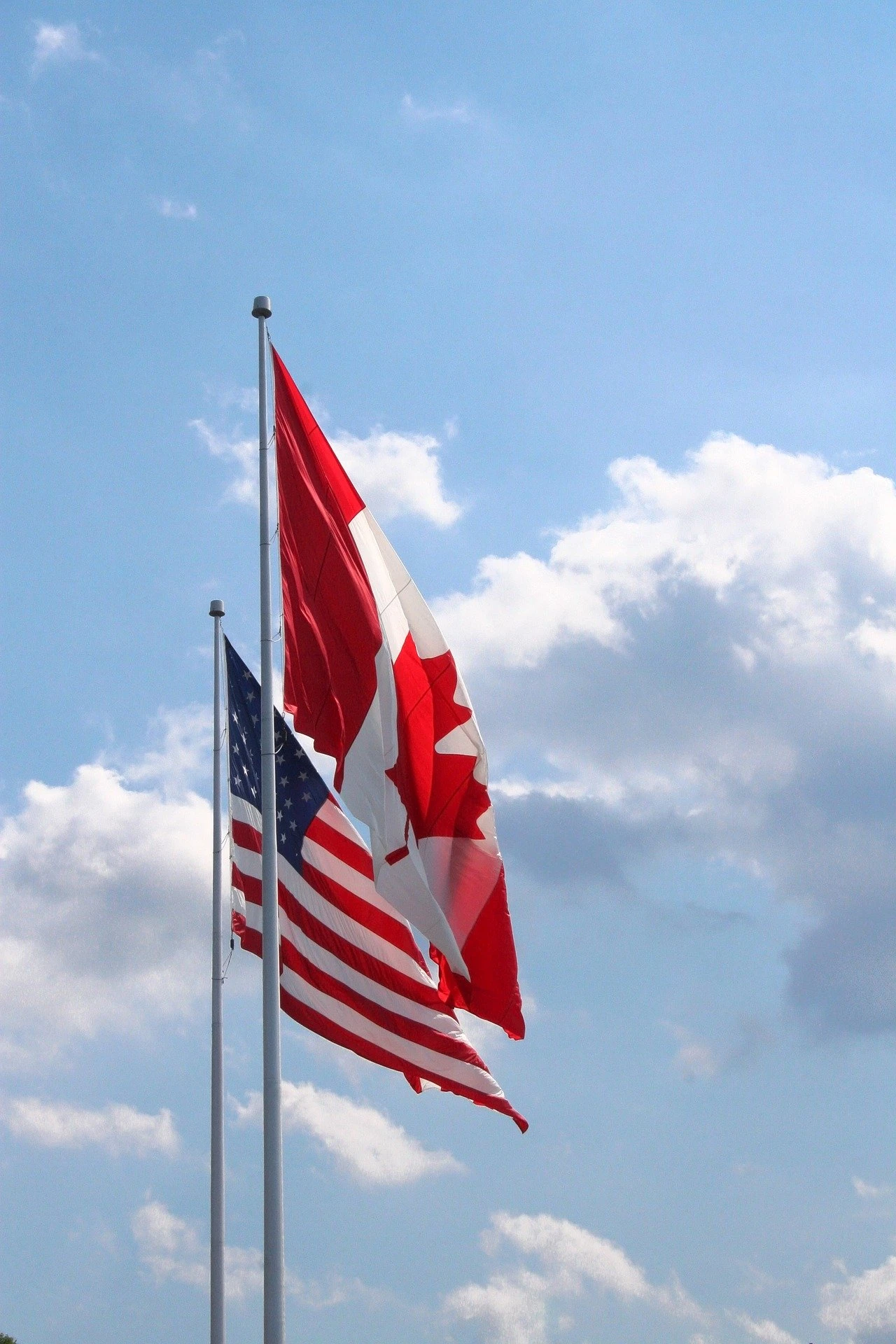 the Canadian flag and the American flag side by side