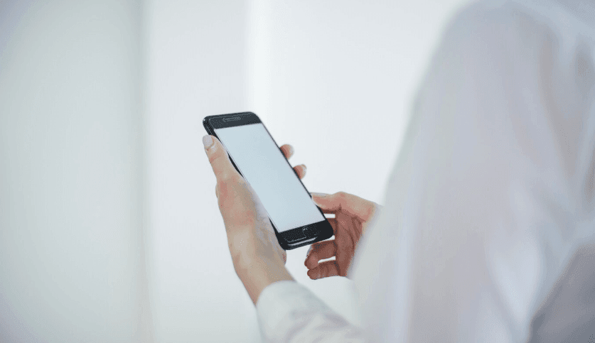 A man checking his mobile phone.