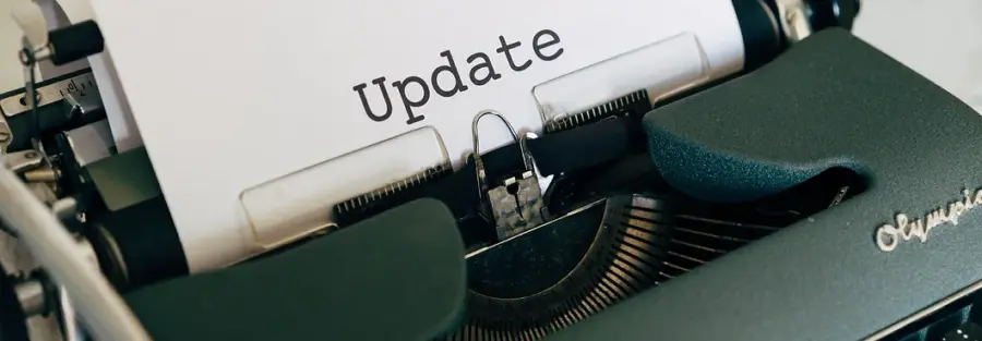 an Olympia typewriter with the word "Update" typed on a sheet of paper