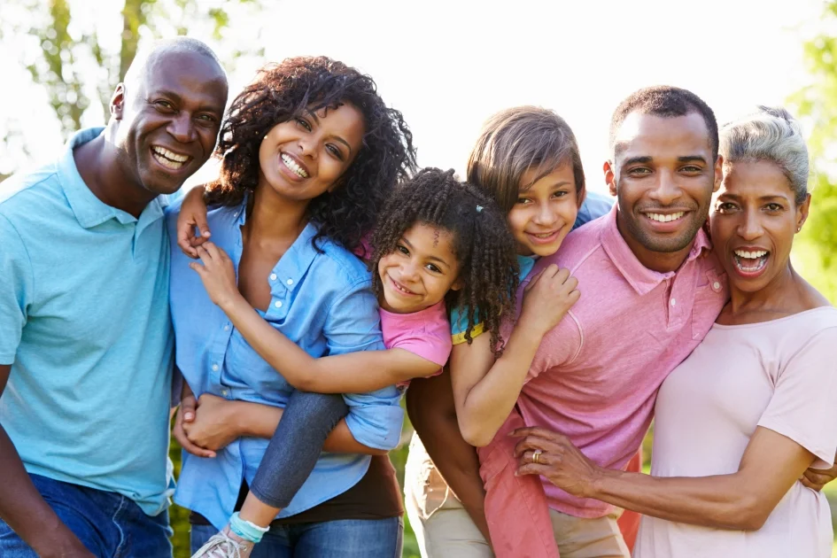 a family of 6 standing together and smiling