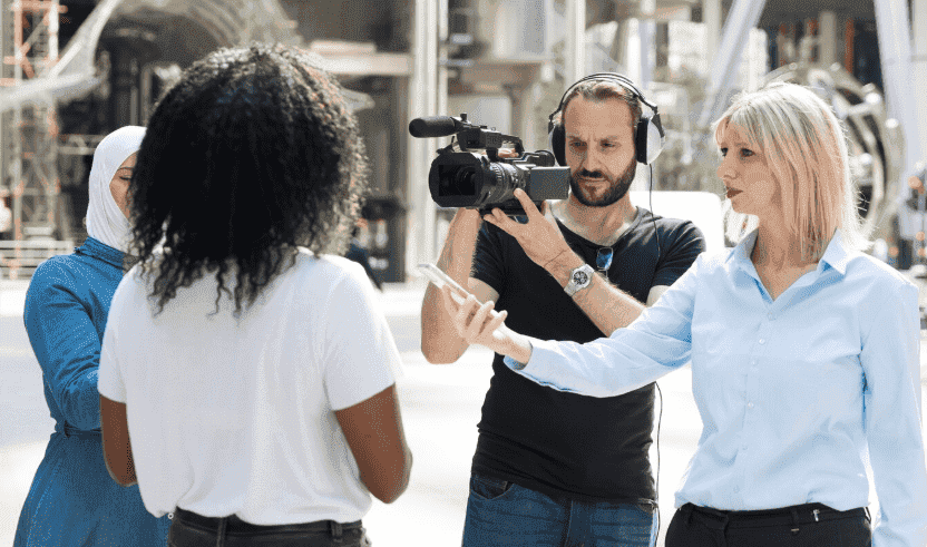 Several people being interviewed on television.