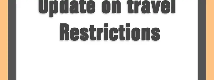 a banner with "update on travel restrictions" written on it