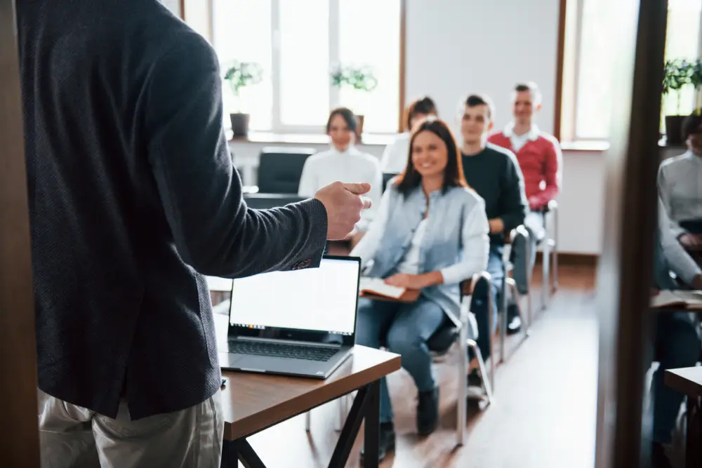 Instructor speaking to students in a classroom in Canada, related to changing Designated Learning Institution number
