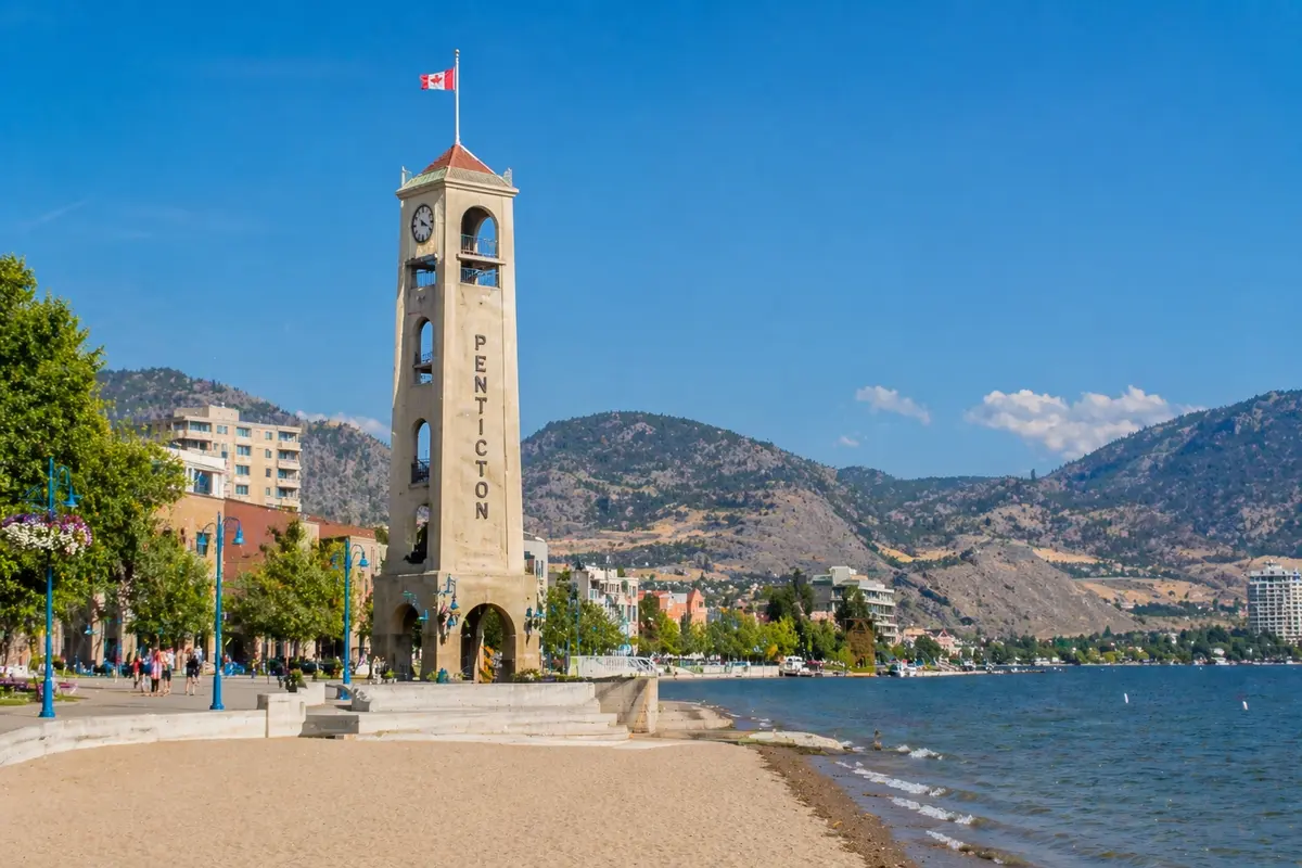 “Lakeside scene in Penticton featuring iconic waterfront landmark and sandy beach along Okanagan Lake”